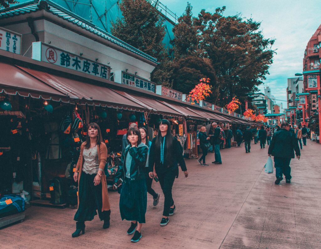 Vibrant street shopping scene in Tokyo's bustling district, capturing diverse pedestrians.