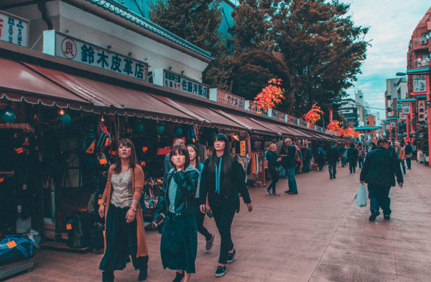 Vibrant street shopping scene in Tokyo's bustling district, capturing diverse pedestrians.
