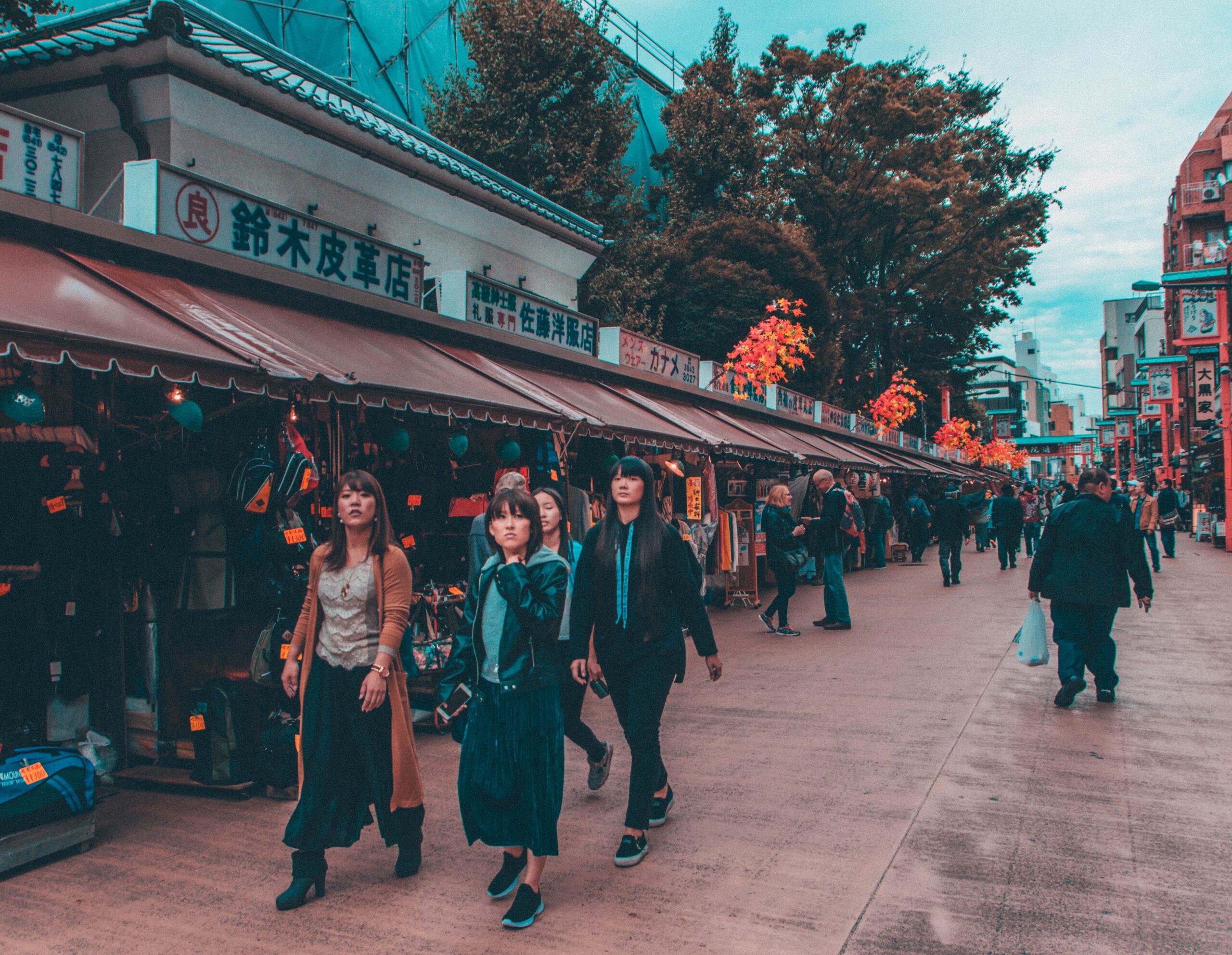 Vibrant street shopping scene in Tokyo's bustling district, capturing diverse pedestrians.