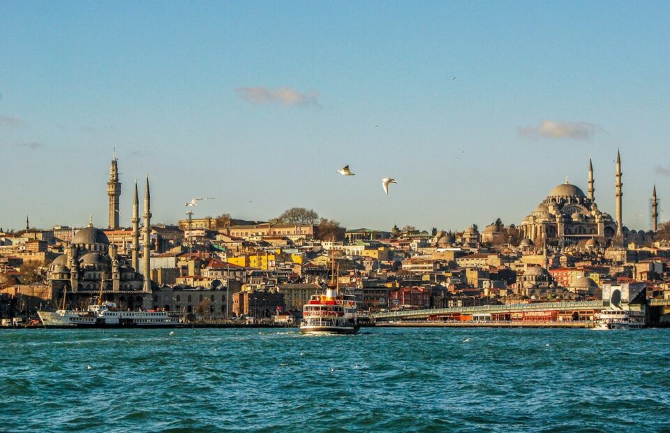 A ferry crossing the Bosphorus with the skyline of Eminönü, Istanbul, in the background