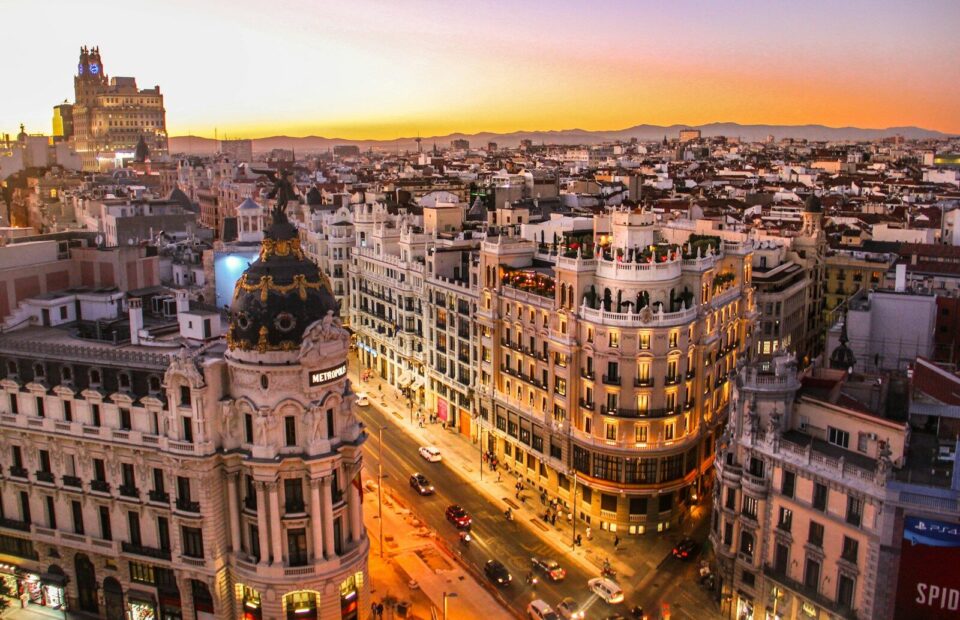 An aerial view of the Metropolis building and Gran Via in Madrid at low sun